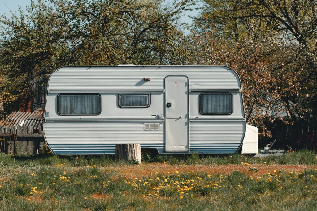 trailer with wildflowers growing in front